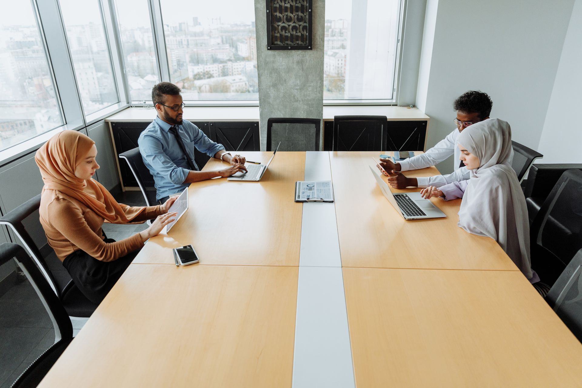 Business team coordinating work around a conference table